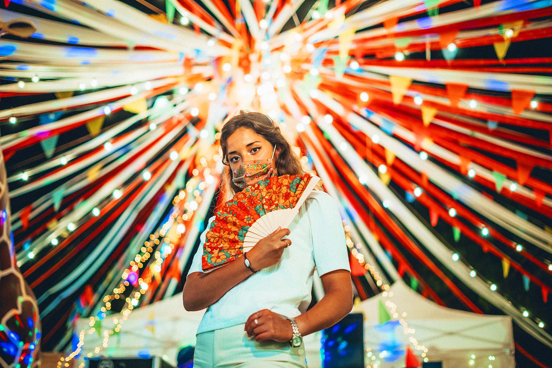 Beautiful European female wearing a floral mask at an amusement park Local-Traditions_SeeffMauritius